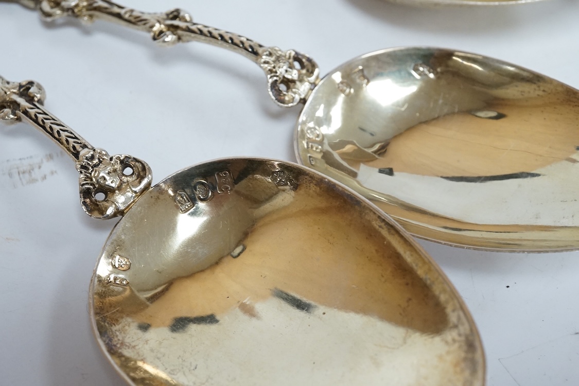 Four 19th century Dutch gilt white metal spoons, including a pair with import marks for Louis Landsberg, London, 1890, 83mm, 7.2oz.